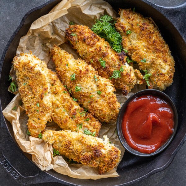 Baked chicken tenders with dipping sauce.