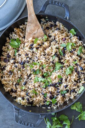 Black Bean & Rice in a pan with spoon.