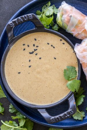 Peanut Sauce for Spring Rolls in a dipping dish.