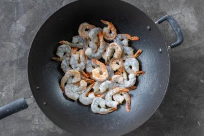Shrimp cooking in a wok.