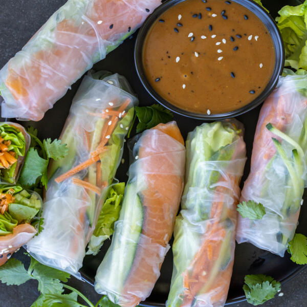 Spring Rolls With Salmon with peanut sauce.