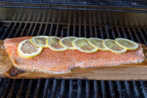 Grilling salmon on a plank.
