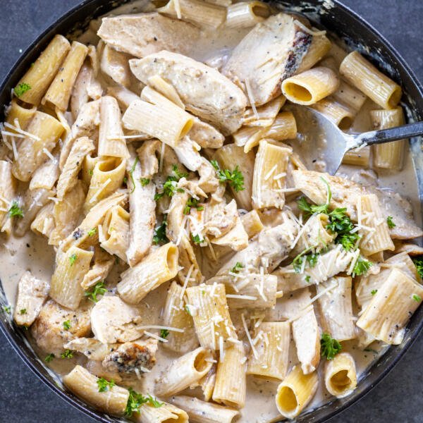 Creamy Chicken Pasta with herbs in a pan.