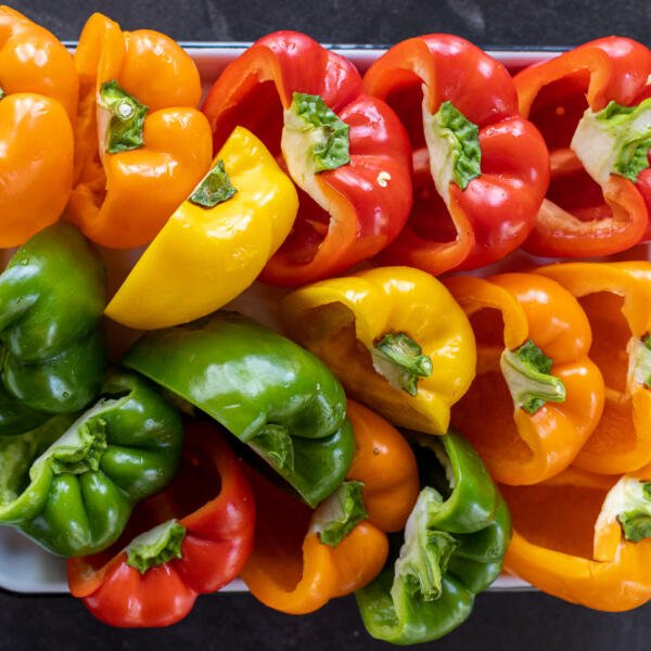Cut open peppers in a pan.