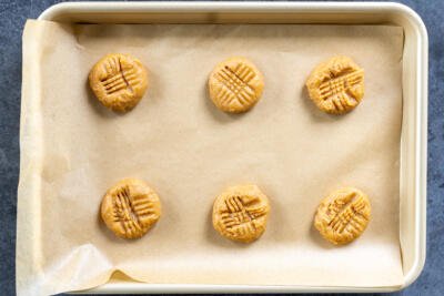 Shaped cookies on a sheet pan.