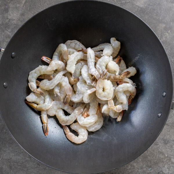 Shrimp cooking in a wok.