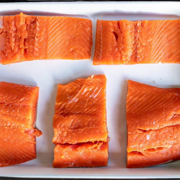 Sliced salmon on a tray.