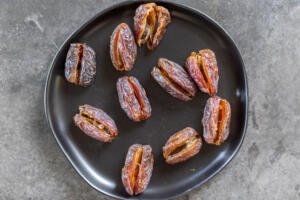 Dates cut open on a palte