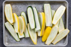 Sliced zucchini and squash on tray.