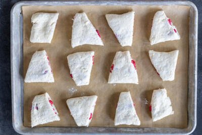 Shaped Raspberry Scones on a baking pan.