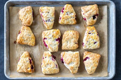 Baked Raspberry Scones on a pan.