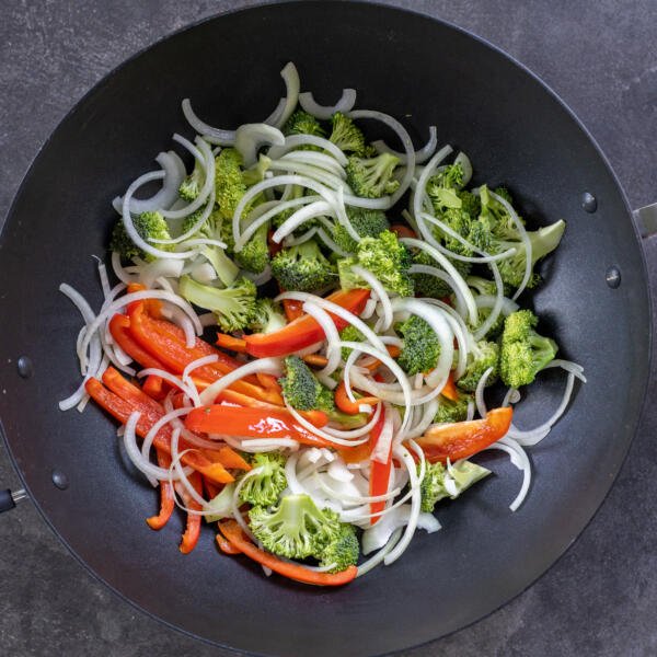 Wok with all the veggies cooking.