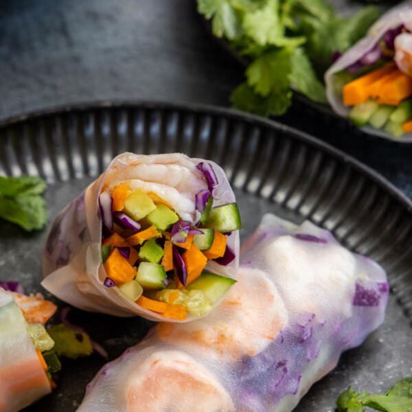 Spring rolls on a serving tray cup open.