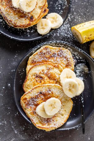 Banana pancakes on a serving plate.
