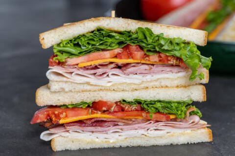 Club Sandwiches on top of each other.