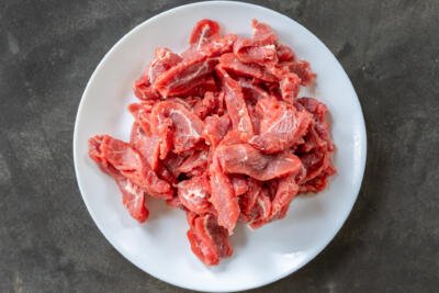 Sliced beef on a plate.