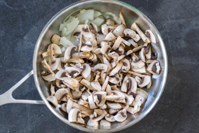 Mushroom and onion in a pan.