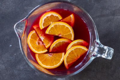 Oranges with Sparkling Cranberry Punch in a bowl.