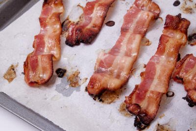 Cooked bacon on a tray.