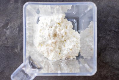 Cottage cheese with salt in a blender.