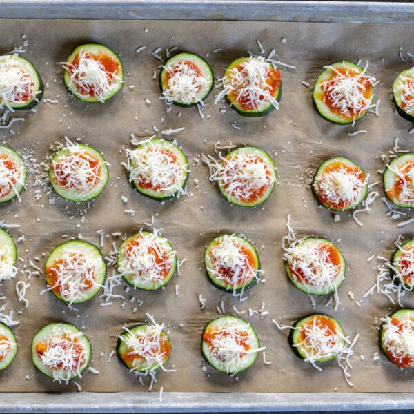 Zucchini with pizza sauce and cheese on top.