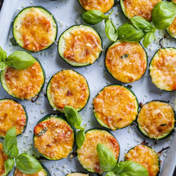 Zucchini Pizza Bites baked on a baking sheet.