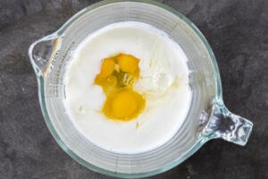Buttermilk and eggs in a dish for pancakes.