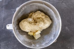 Dough with butter added to the mixing bowl.