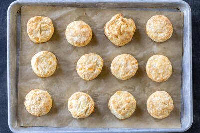 Baked Cheddar Cheese Biscuits on a baking sheet.
