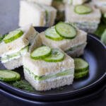 Mini Cucumber Sandwiches on a plate.