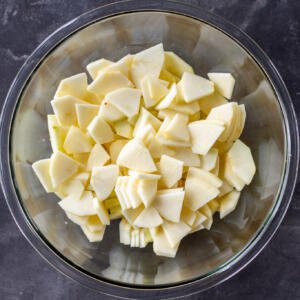 Sliced up apples in a bowl.