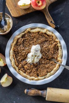 Dutch Apple Pie in a pan with ice cream on top.