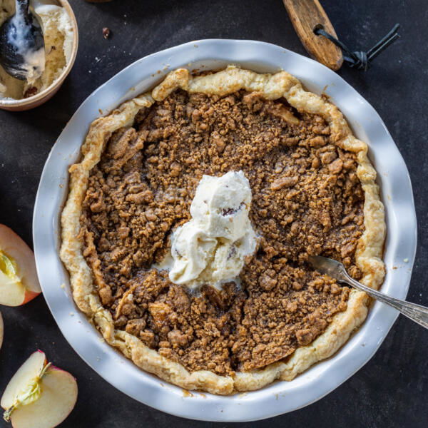 Dutch Apple Pie in a pan with ice cream on top.
