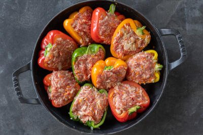 Stuffed peppers without sauce in a pan.