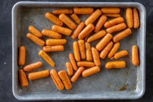 Roasted carrots on a baking sheet.