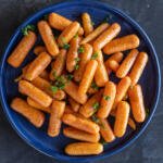 A plate with Roasted Baby Carrots.