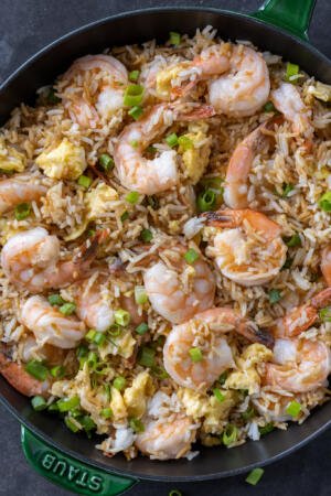 Shrimp fried rice in a pan.