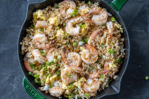 A pan with shrimp fried rice.