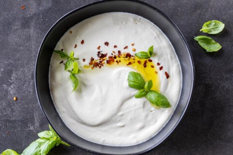 Whipped Feta Dip in a bowl with spices.