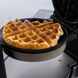 Waffle in a waffle maker.
