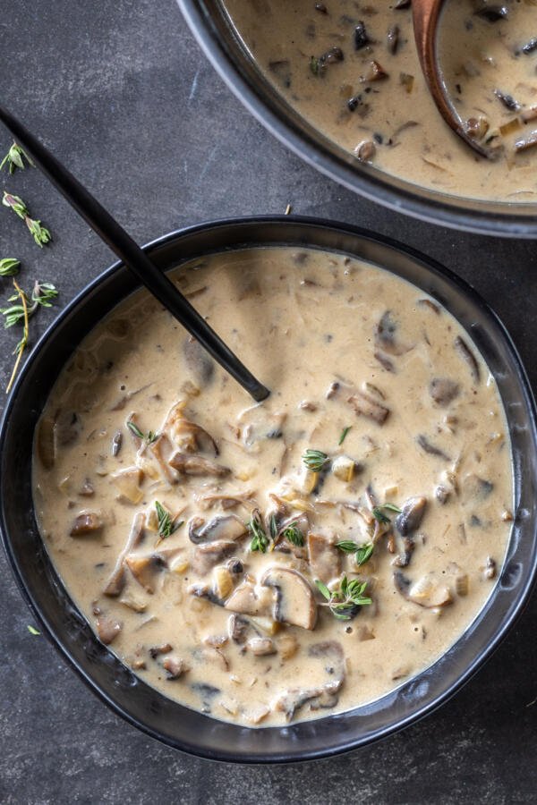 Cream of Mushroom Soup in a bowl with a spoon. 