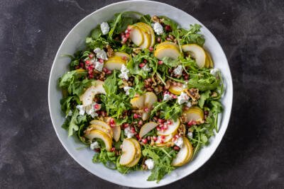 Pear and Walnut Salad in a bowl with out dressing.