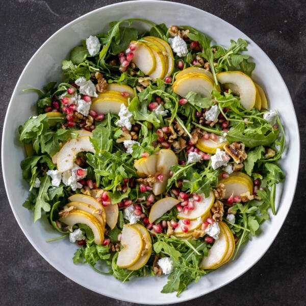 Pear and Walnut Salad in a bowl with out dressing.