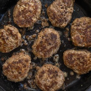 Meat patties in a pan.