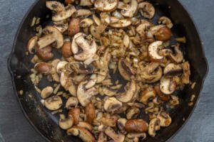 Mushroom with onion in a pan.