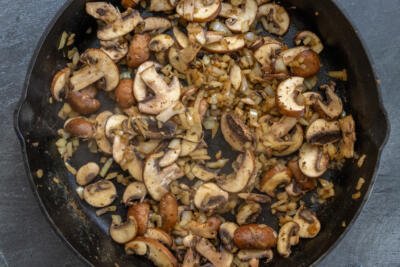 Mushroom with onion in a pan.
