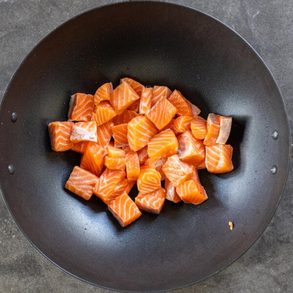 Salmon in a wok.