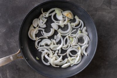 Sliced onions on a pan.