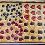 Sheet Pan Pancakes baked with berries.