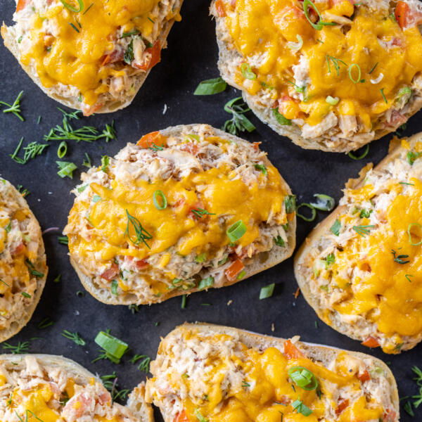 Tuna melts on a tray wit herbs.